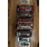 Diecast 1:18 scale vehicles including Motor CIty Chrysler, Road Signatures, Ford Pick Up, Road