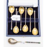 A cased set of enamel silver gilt teaspoons, marks only partially distinct showing 84 Zoloniks mark