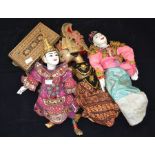 Three puppets, circa 20th Century along with a box