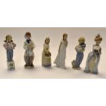 Six various Lladro figurines to include clown , dressing up etc