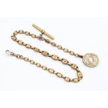 A Victorian  fancy link 9ct gold fob chain, star engraved decoration to each link, gilt metal T