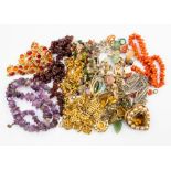 Costume jewellery collection to include; polished garnet, amethyst, coral necklaces, brooches, etc