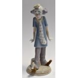 Lladro: a young girl clown with bird on toe.