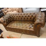 An early 20th century chesterfield leather three seater sofa.