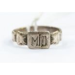 A silver lovers ring, in the form of a ribbon knotted with the initials 'MD', size O 1/2, approx 2.3