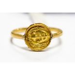A Greek gold signet ring, circa 3rd Century, the gold disc front with the head of Apollo to both