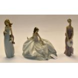 3 Lladro classic lady figures, one seated in a chair. Condition: All in good overall condition.