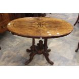 A 19th Century design oak oval side table, on turned supports on a quadruple platform on cabriole