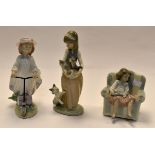 Lladro: three young girl figurines, A girl with cat and kitten no 1309, girl on a scooter no 6301