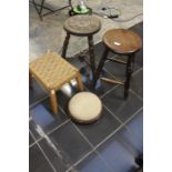 Four stools, a carved bobbin leg stool, a Victorian footstool, a  small wicker stool and an oak