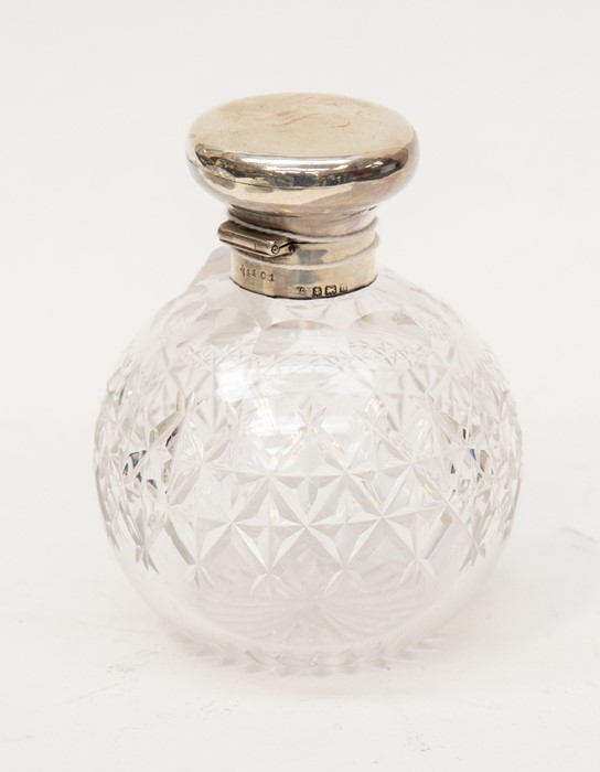 A cut glass cologne bottle with silver top, fitted stopper, Birmingham 1912, 9cm diam