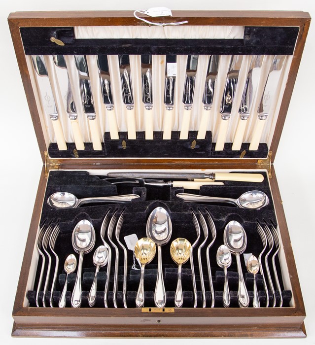 A cased six place canteen of Viners cutlery including carving set and gilt bowl fruit spoons, tea
