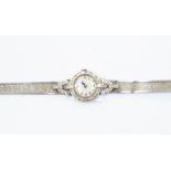 A 9ct white gold and diamond set cocktail watch, with later 9ct strap, gross weight approx 24.9gms