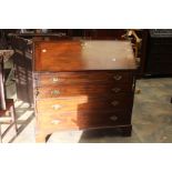 A George III mahogany bureau, circa 1800, fall front opening to small drawers, pigeon holes and