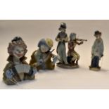 Lladro musical clown figures including no's 5472, 5585, 5856, 5600. 4 items Condition: All in good