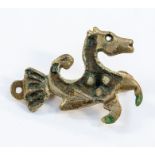 A white metal Roman style brooch, in the form of a sea horse, approx 5.5 cms long