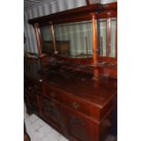 An early 20th mahogany mirror back sideboard dresser, dome carved cornice, cabriole supports,