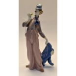 A Lladro study of a female clown with flower in gloved hand.