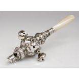 A Victorian silver babies rattle with whistle, with five bells suspended, ornate body and mother-