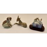 Lladro: A spaniel puppy- knocked over flowers, a Lladro donkey and a Nao pair of rabbits-