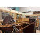 An early 20th century oak Sheila Maid laundry rack with cast metal frames.