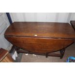 A George III oak gateleg table, oval top above a single drawer on turned supports. Circa 1820