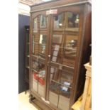 An early 20th Century oak glazed bookcase.