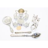 A collection of silver miniature furniture including a small trophy and hand mirror, approx 6.75
