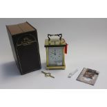 A Carriage Clock by Mathew Norman, complete in original case.