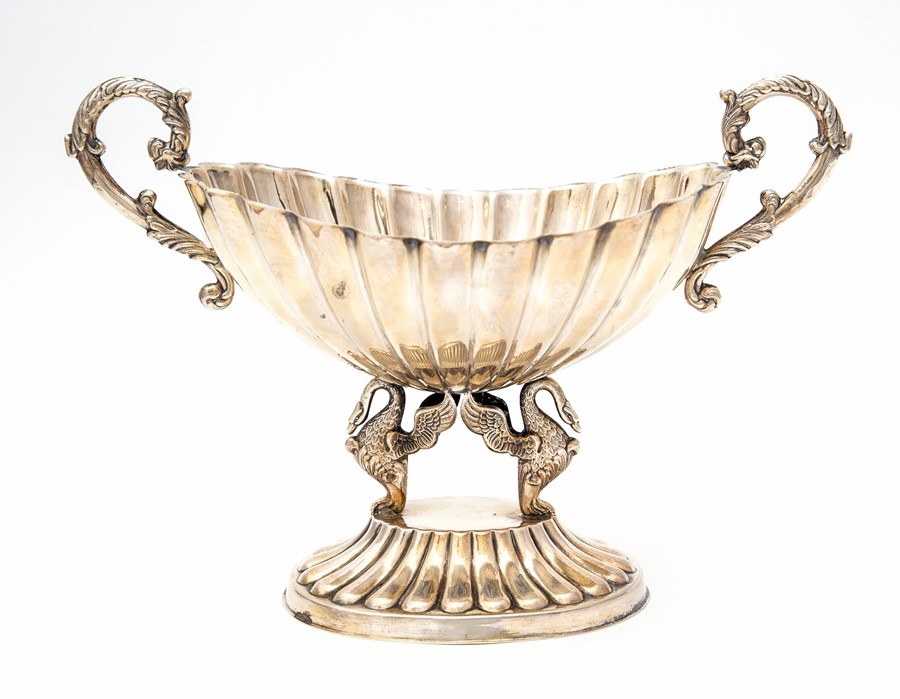 A Spanish .915 silver twin handled centrepiece, fluted oval bowl with scroll handles, on two