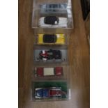 Six 1:18 scale diecast vehicles including Jada Chevy, Sun Star Ford Galaxie, etc, all in a perspex