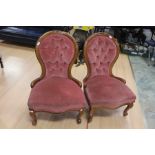 A pair of Victorian mahogany reupholstered spoon back nursing chairs, for decorative purposes