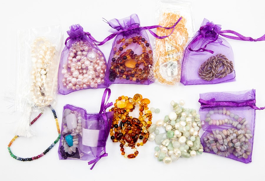 A collection of precious and semi precious bead jewellery to include a loose string of rough cut