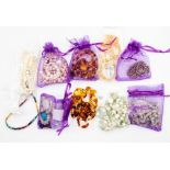 A collection of precious and semi precious bead jewellery to include a loose string of rough cut