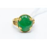 An 18k jade ring, set and cabochon, approx 8g