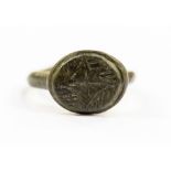A medieval iron type Continental seal ring, basic intaglio seal of a cross v lines