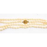 A single string cultured pearl necklace with a 9ct gold clasp