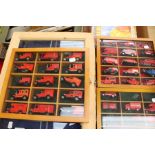 A collection of display cabinets, some containing diecast vehicles.