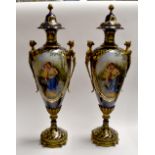 A pair of large modern reproduction vases and covers in gilt metal mounts, painted with maidens