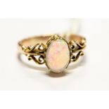 A 9ct gold ring set with a cabochon opal, size J1/2, approx 2.8gms