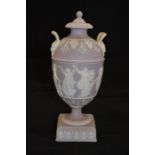 A mid 18th Century Wedgwood lidded urn light purple ground with classical figures dancing and two