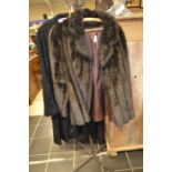 A faux fur 3/4 dark brown jacket, and a black 1950's lamb coat (2)