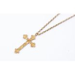 A 9ct gold cross with engraved detail on a unmarked yellow metal chain, total gross weight approx
