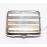 A George VI silver cigarette case, engine turned with serrated pattern, gilt interior, by FC