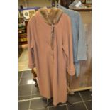 A wool camel coat, large size, has covered buttons, turned back cuffs, faux fur hood, made by