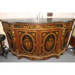 A 19th Century Louis XV Revival Kingwood ormolu serpentine sideboard, fitted with black marble