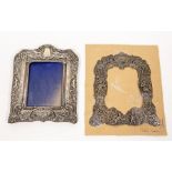 A Victorian silver photograph frame, heavily embossed in relief, Birmingham 1901, 22cm x 17cm;