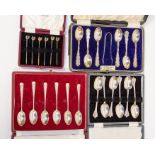 Three sets of silver spoons cased, along with silver cocktail sticks, one set by Walker & Hall,