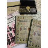 A collection of race books and Victoria commemorative items