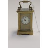 A miniature French brass cased carriage clock, Edwardian 1901-10